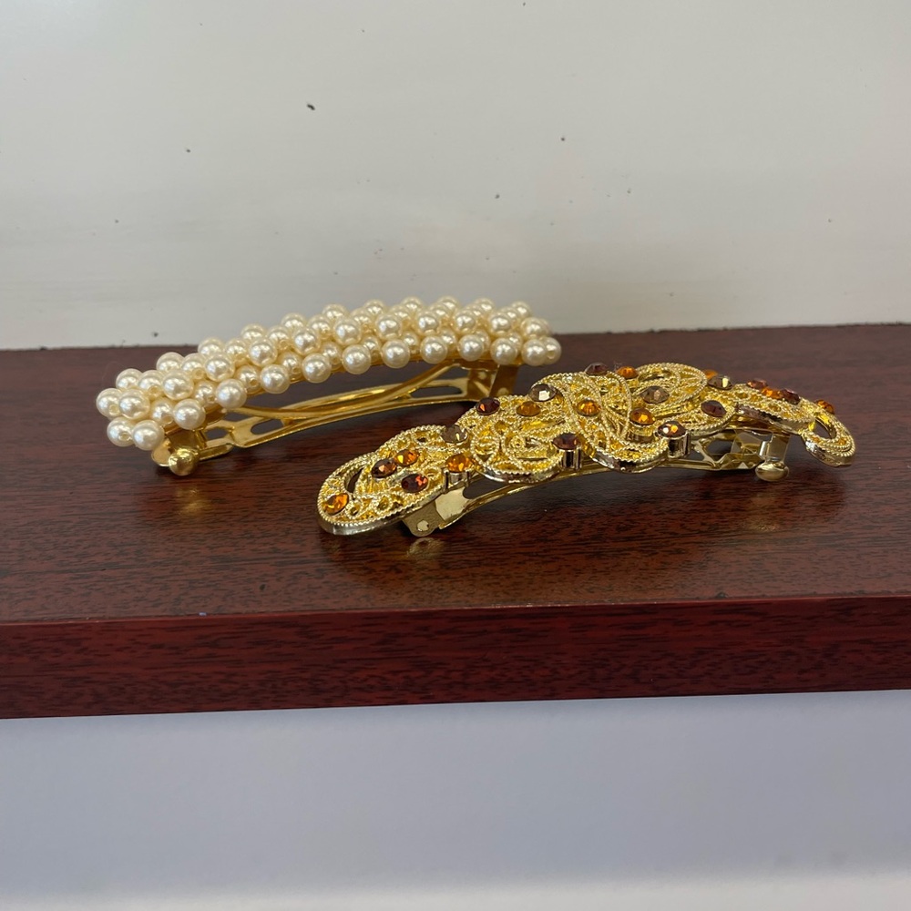 TWO (2) BEAUTIFUL ORNATE BARRETTES.